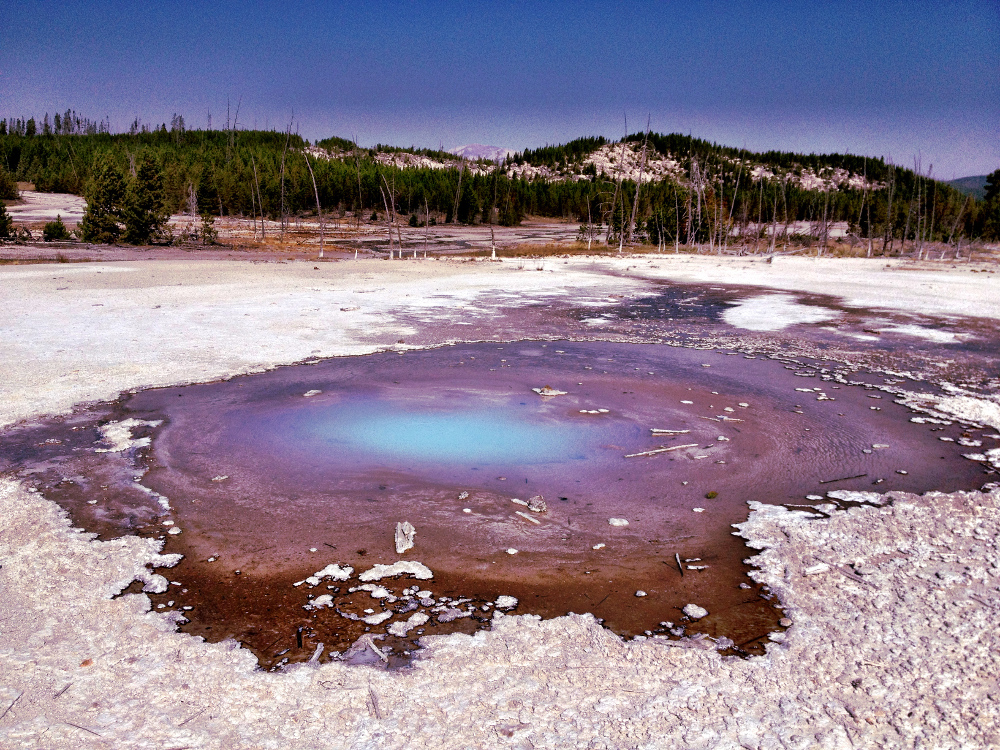 blue colours of geysers at Yellowstone Double-Barrelled Travel
